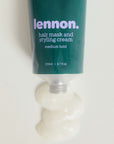 Tube of Lennon hair mask and styling cream on a white background