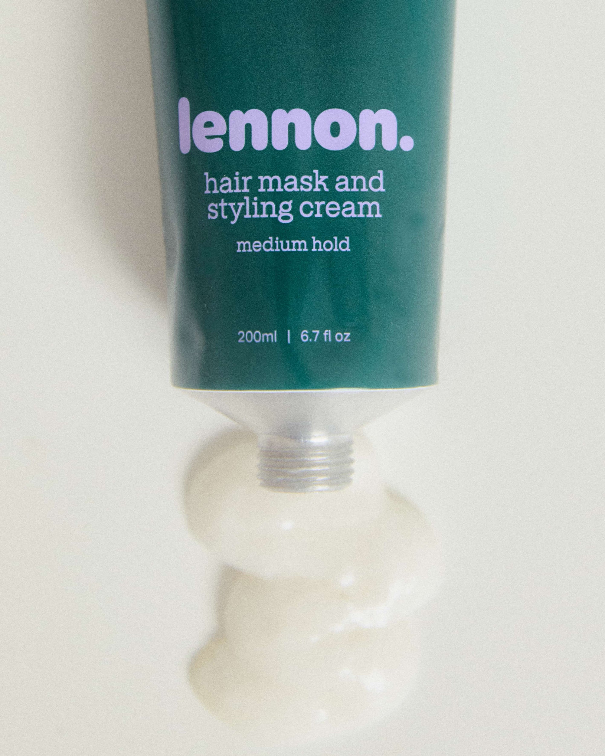 Tube of Lennon hair mask and styling cream on a white background